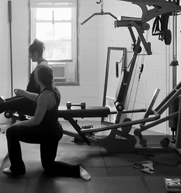 Greenville SC Personal trainer explaining hypertrophy to client at Gray Training personal training studio