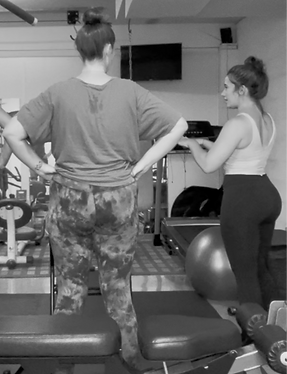 Personal trainer in Greenville SC explaining progressive overload after posterior strength day at Gray Training personal training studio
