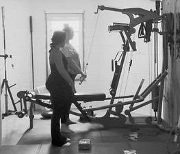 Gray Training : personal trainer coaching cleint through cable lat pulldowns : personal training in Greenville SC