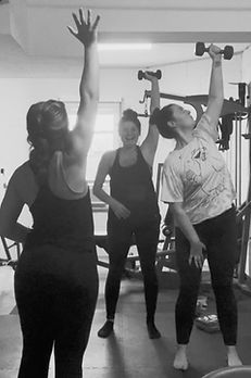 Greenville SC personal trainer going over form at Gray Training Personal Training Studio