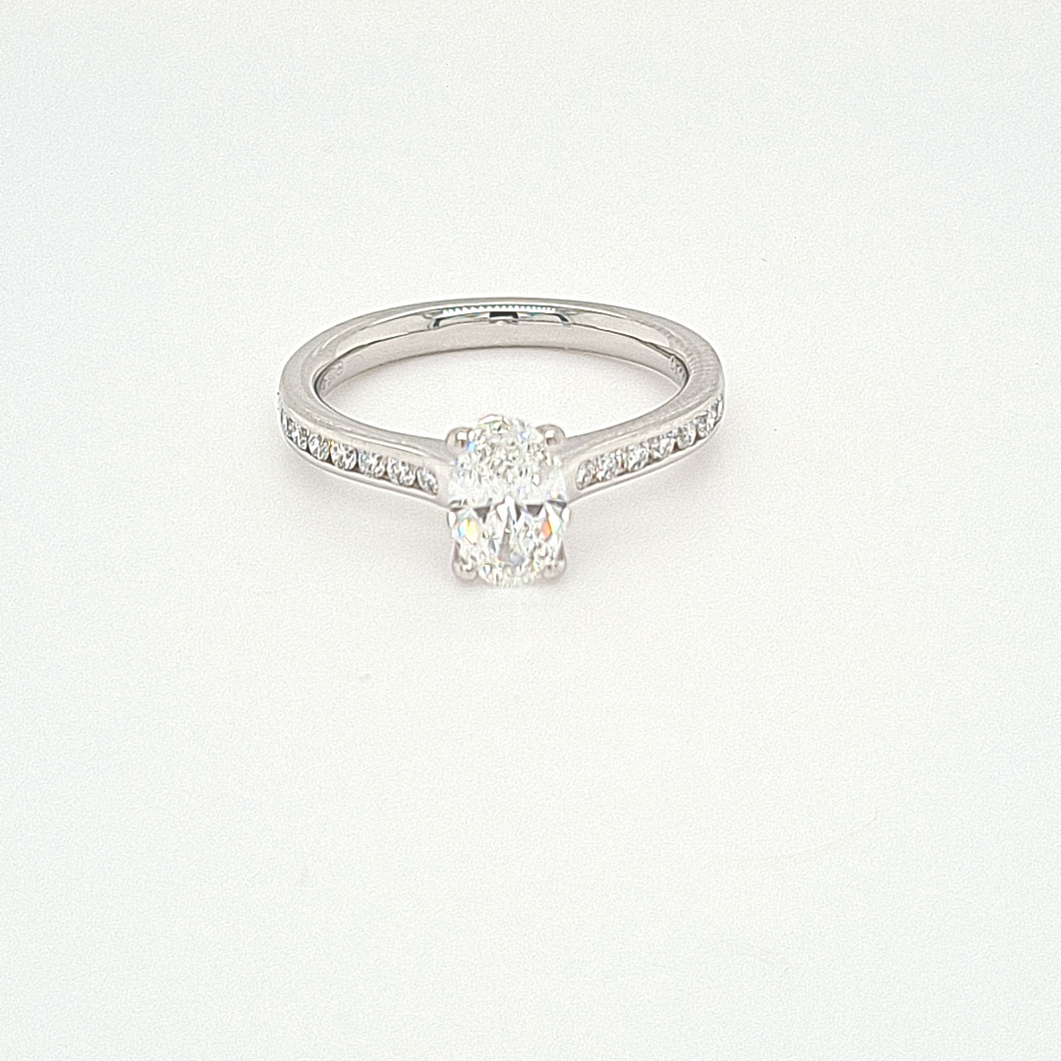 Platinum 950 Four Claw Oval Diamond Center With  Channel Set Shoulders