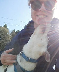 Picture of business owner with a sweet dog