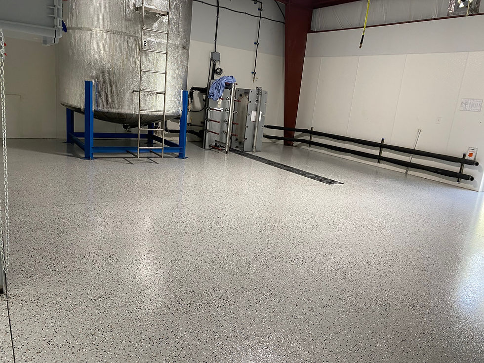 Industrial room with stainless steel tank and clean floor