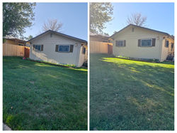 Before and after of grass on side of home, transformed from long grass to freshly mowed and neatly m