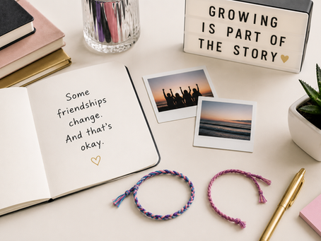 Two friendship bracelets on a plain surface with one set slightly apart, illustrating outgrowing a friendship.