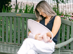 Latching a Baby While Using a Nursing Cover—and How Snugghug Makes It Easier