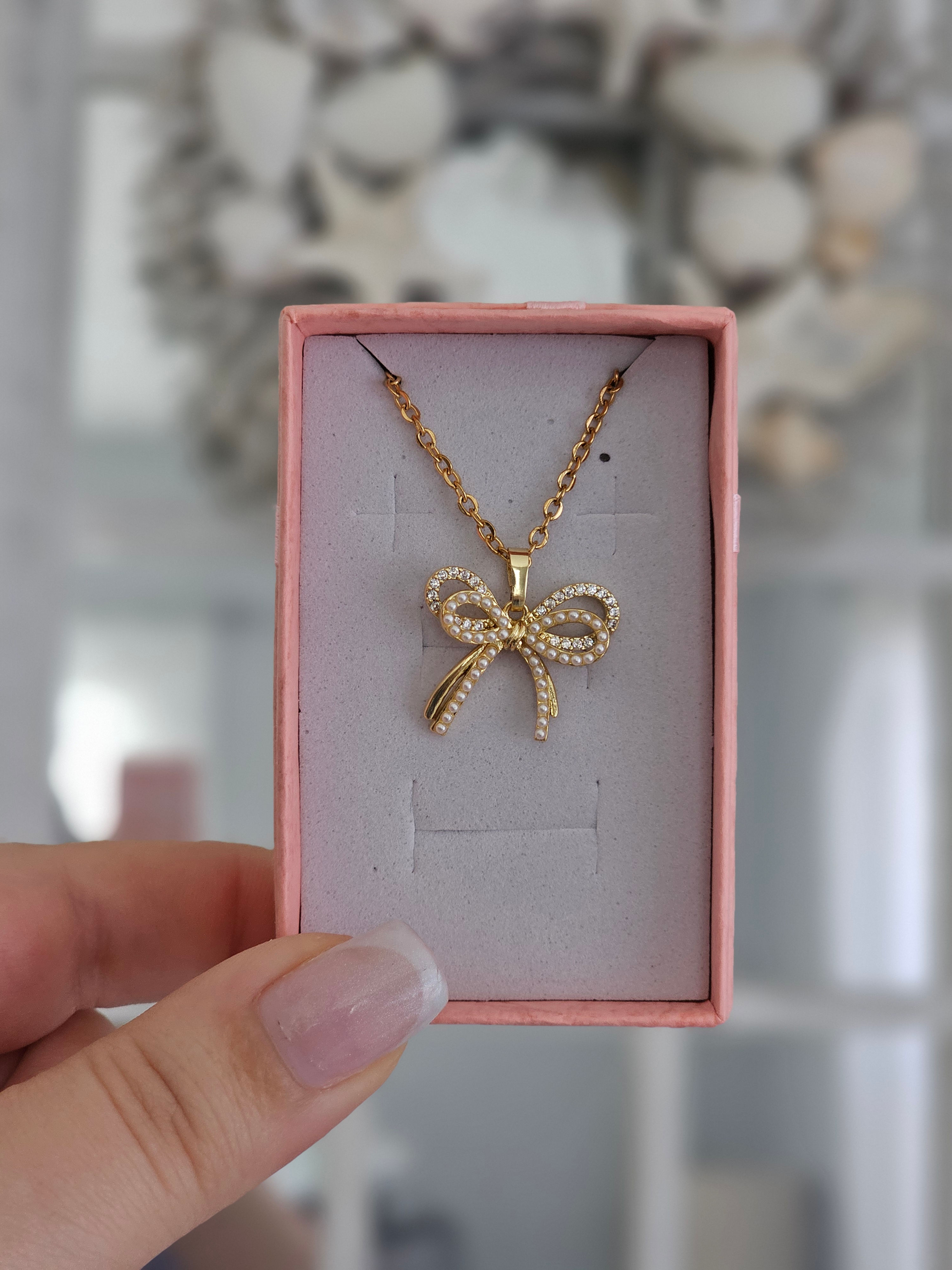 Double Pearl Bow Pendant