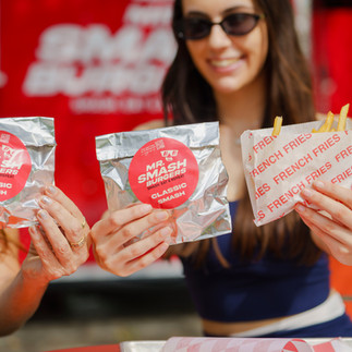 Park guests giving Mr Smash Burgers a try at Huizenga Park
