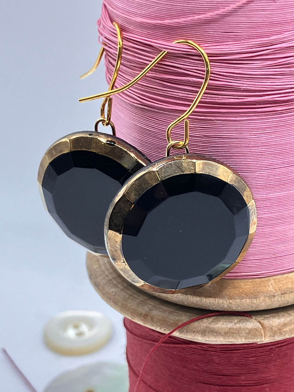 Thumbnail: front view Black glass button earrings with Gold detail