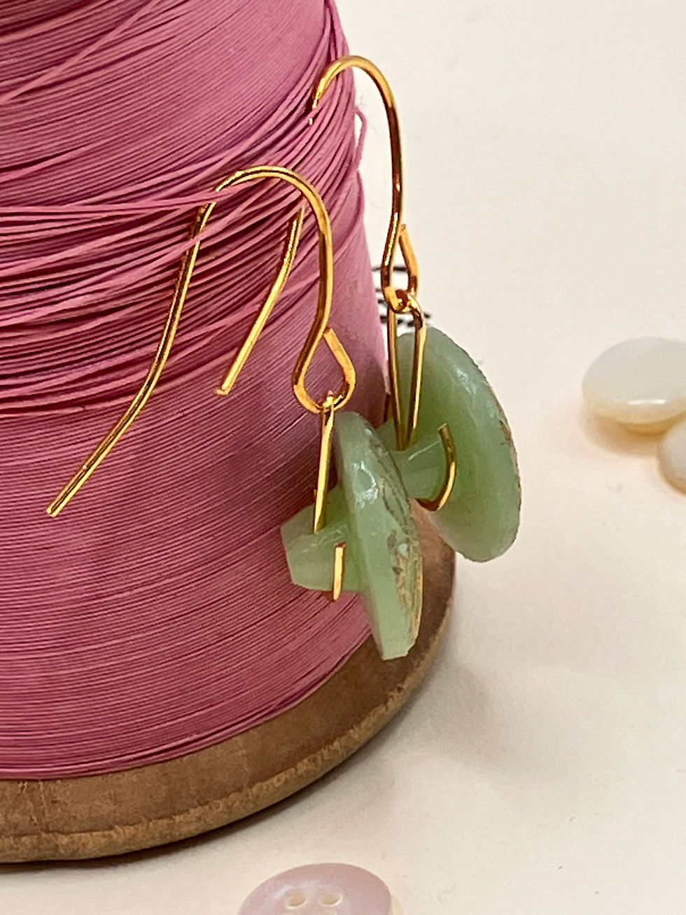 Green glass vintage buttons with gold plated wires