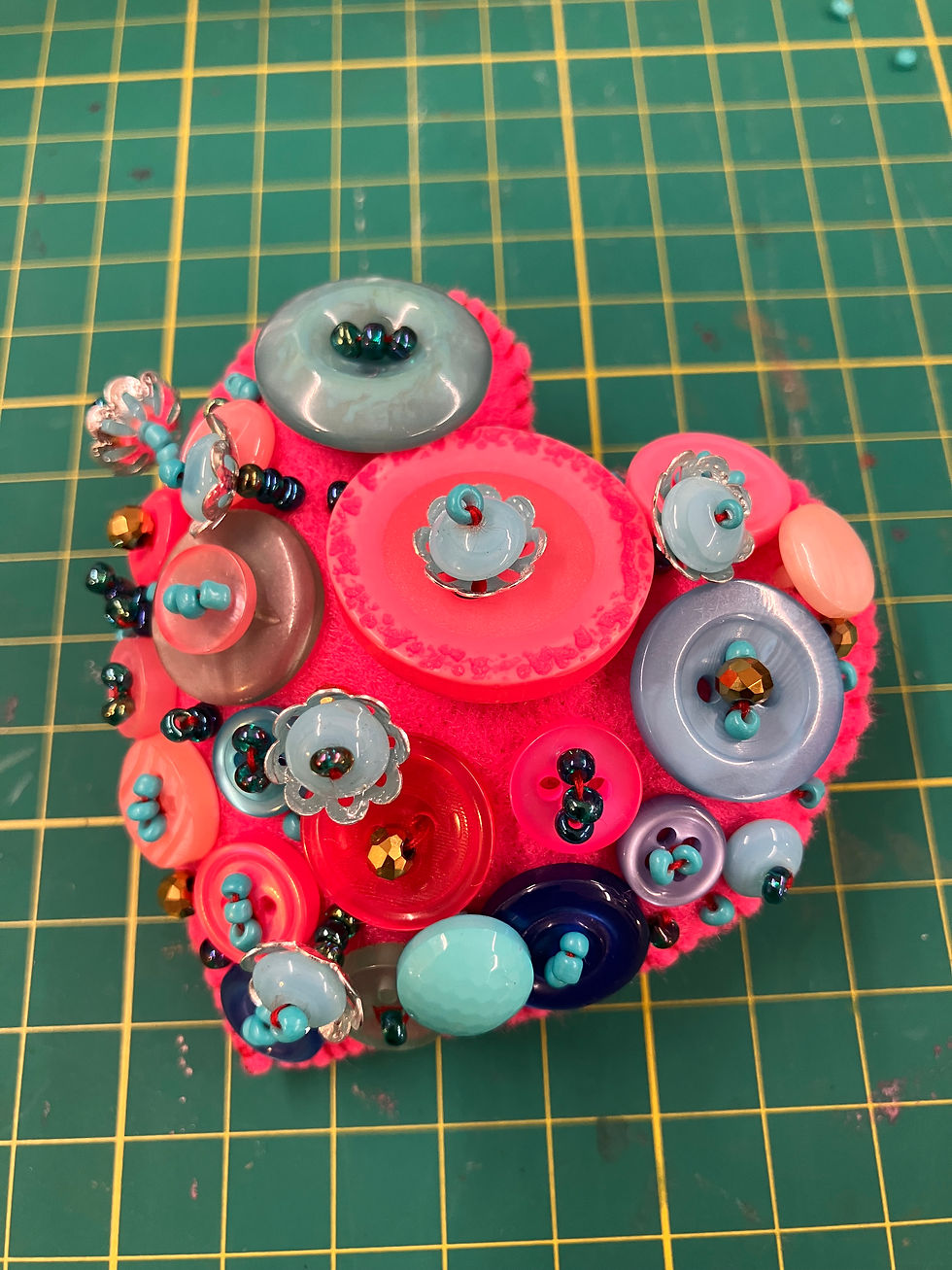 pink heart broach with pink buttons and turquoise beads hand sewing project kit