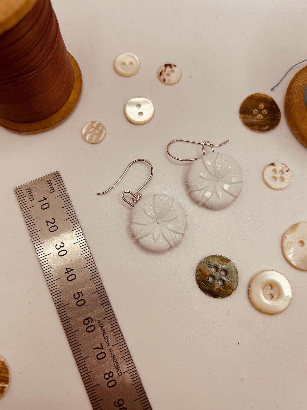 Thumbnail: White vintage button earrings