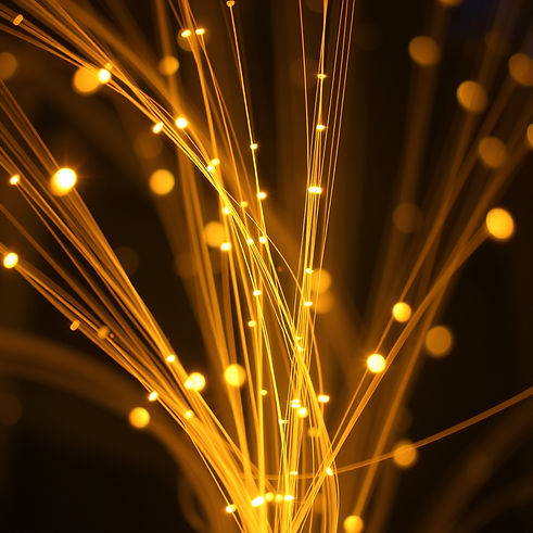 glowing strands of fiber optic cables.jpg