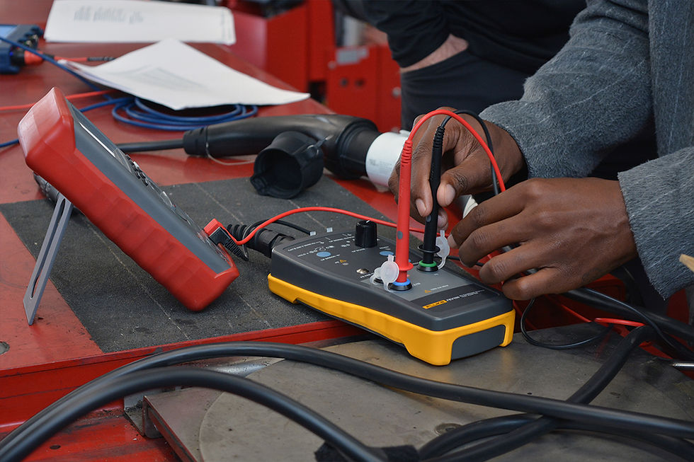 Close-up view of a technician working on an electric vehicle battery system