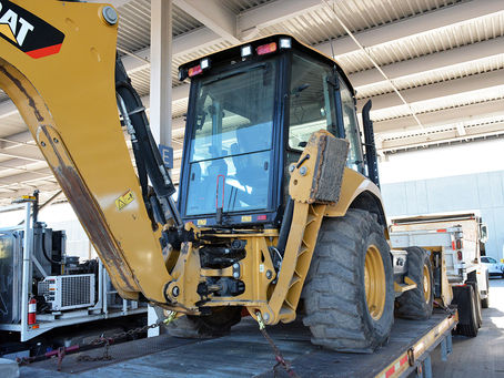 a heavy duty front loader tractor that is equipped with hydraulics
