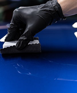 Ceramic coating being applied to a car