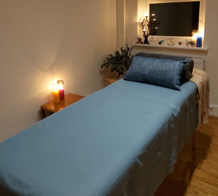 The treatment room set up beautifully, with candles and crystals