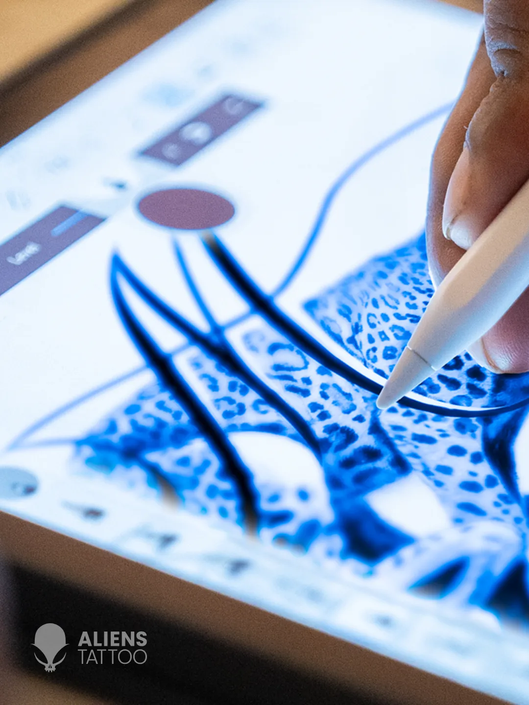 Detail of the abstract leopard in the tattoo design, revealing the hidden letter "M" for Mahieka.