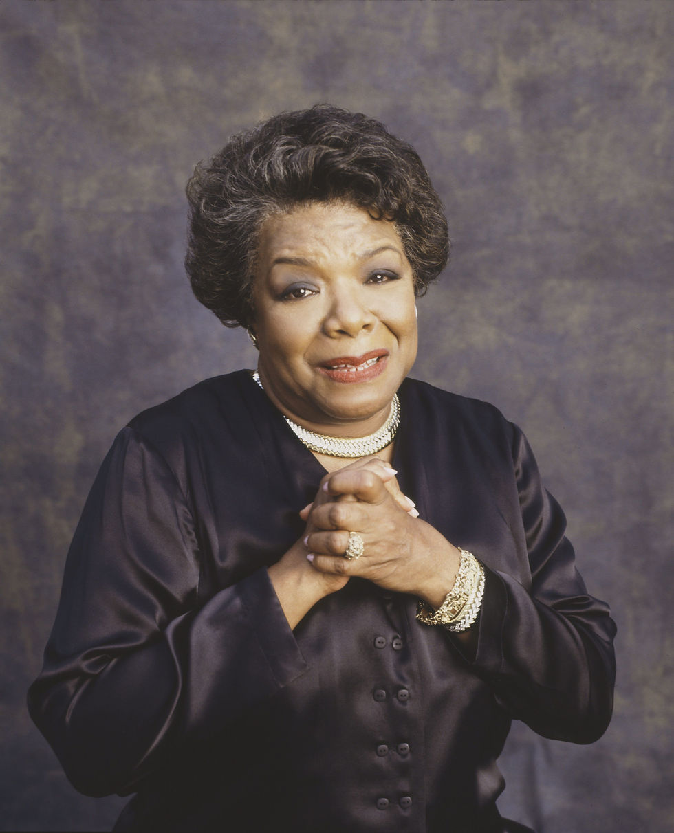 A picture of Maya Angelou with hands clasped across her chest