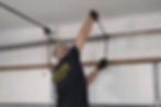 Technician adjusting garage door springs