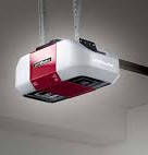 Garage door opener, red and white, attached to the ceiling, EM Garage door service inc.