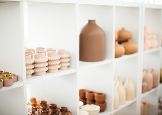 Vases, pots and candleholders are displayed beautifully on shelves at The Wedding Stylist's studio located near Crossley Victoria