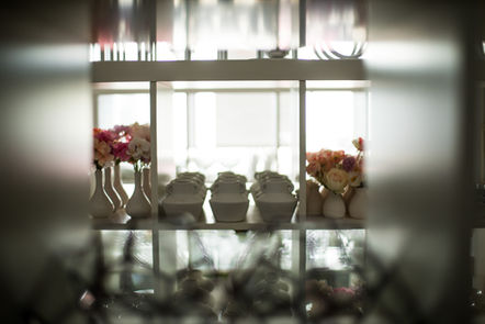 White vases and flowers, wedding hire items