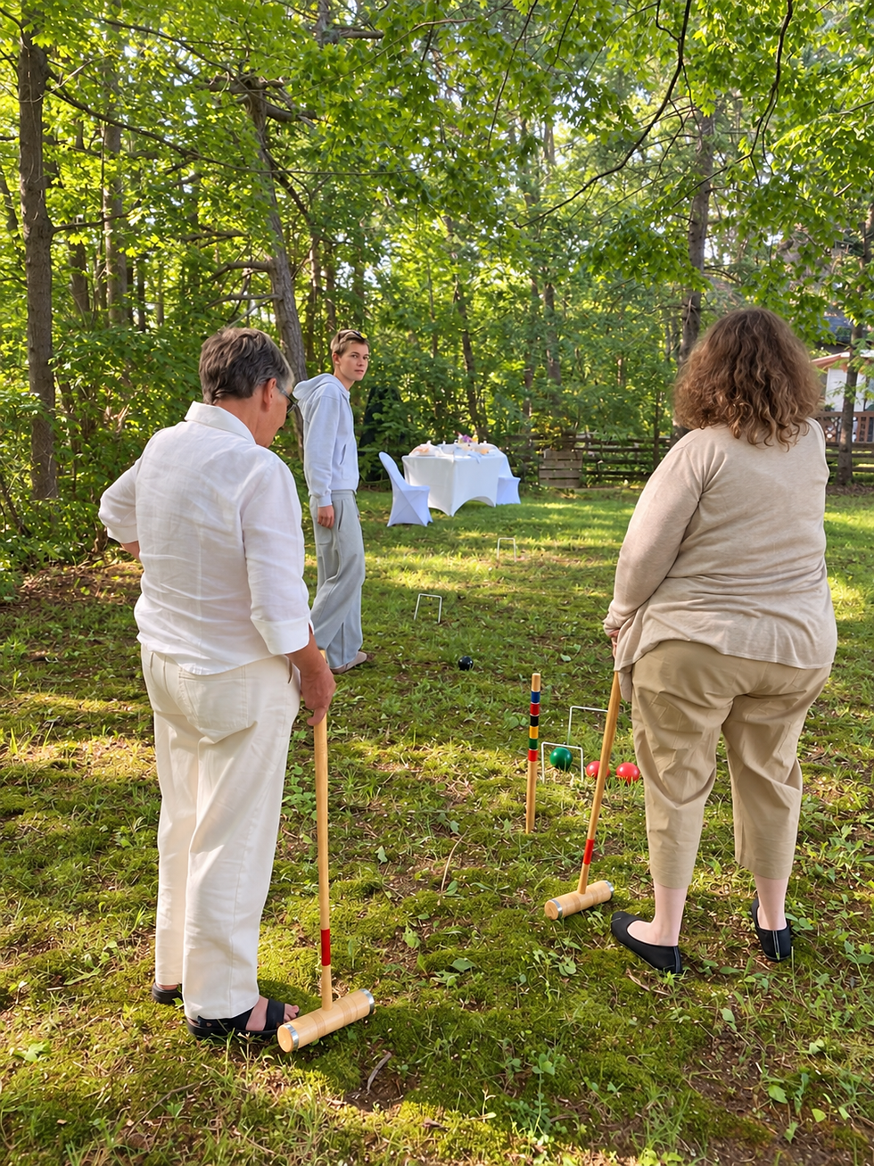 Friends and family enjoying a relaxed game of croquet beneath the trees