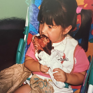 Little Maddy eating a jumbo Disney turkey leg