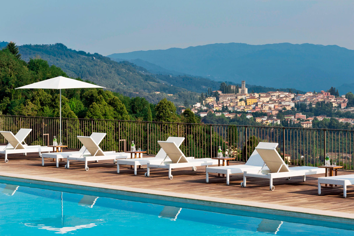 Outdoor pool with beautiful views at the Renaissance Tuscany Il Ciocco Resort & Spa