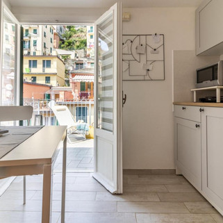 Clean and large kitchen and terrace at WanderJohn in Riomaggiore Penthouse