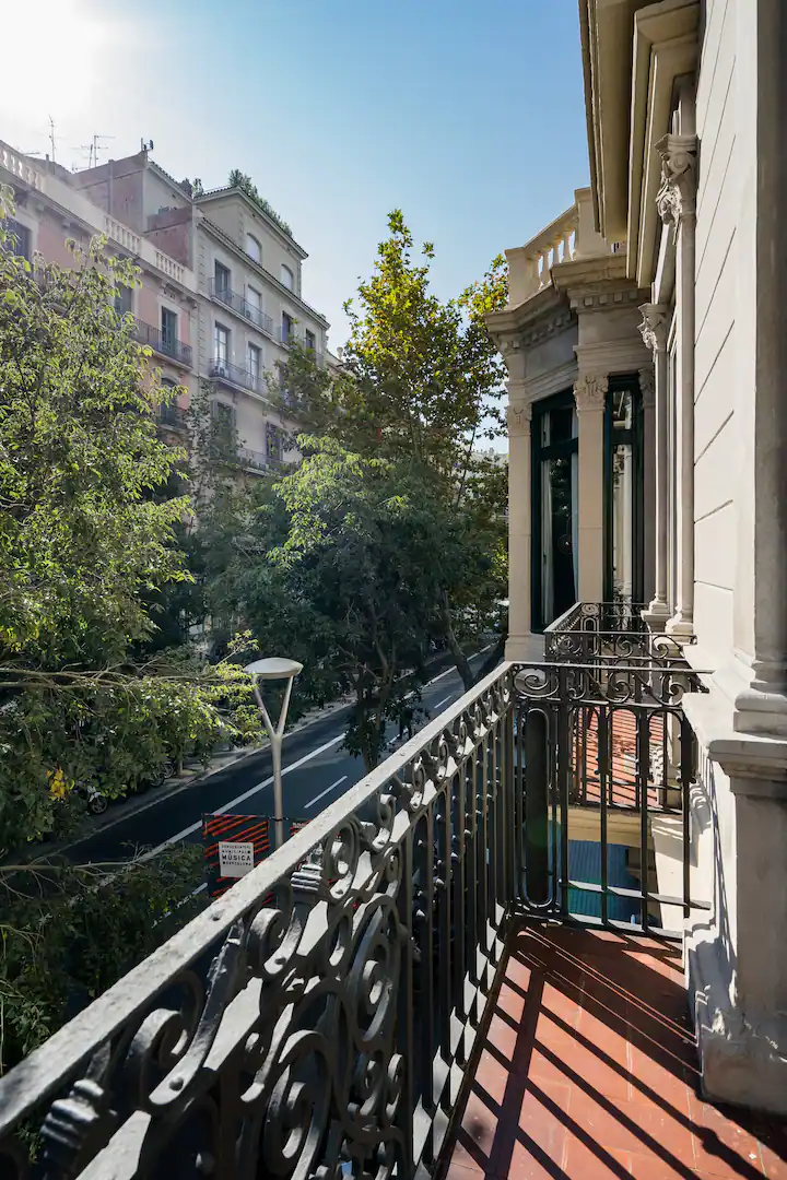 Balcony overlooking the tree-lined Barcelona streets 