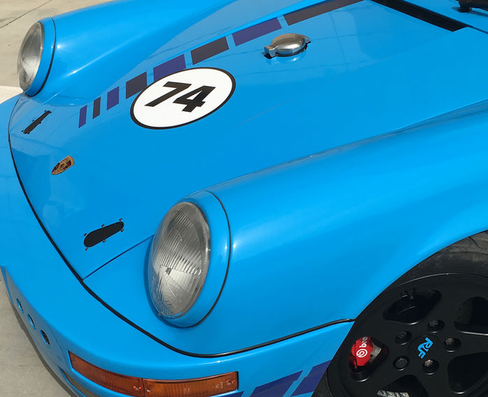 Finished Porsche 911 front end with bespoke bonnet, custom bumper and restored headlights by Classic Hangar.