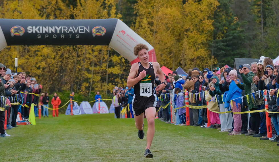 Craig senior Aulis Nelson sprints to the boys state title during the Division III Alaska State XC Championships at Anchorage's Bartlett High School trails on Saturday, Oct. 3, 2026. Nelson won the boys title in 16:41. (Klas Stolpe / Juneau Independent)
