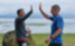 Team Dan & Keith's Keith Levy and Dan Robinson high-five at the finish of the Seacoast Relay on Saturday, June 13, 2026. (Klas Stolpe / Juneau Independent)