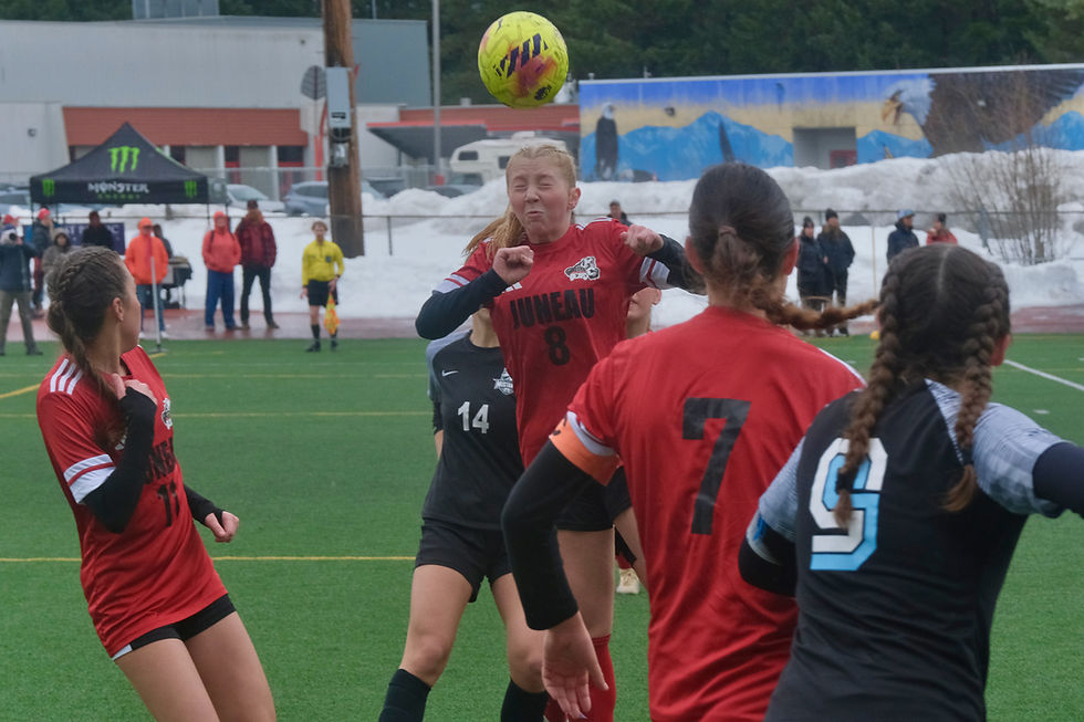 Juneau-Douglas High School: Yadaa.at Kalé junior Riley Schultz (8) a ball during the Crimson Bears' 4-3 loss to the Mustangs at the Adair-Kennedy Memorial Park pitch on Saturday, April 18, 2026. (Klas Stolpe / Juneau Independent)