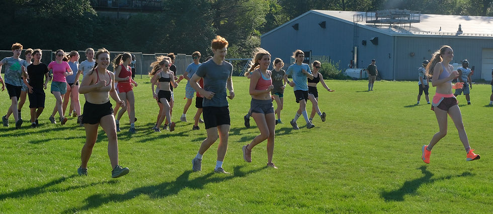 Members of the Juneau-Douglas High School: Yadaa.at Kalé cross country running team do warm-up drills during practice at Savikko Park on Monday, August 10, 2026. (Klas Stolpe / Juneau Independent)