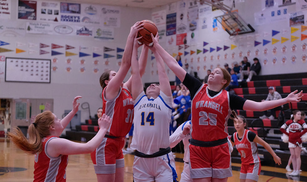 Wrangell senior Shailyn Nelson (35), freshman AJ Roundtree (31) and Junior Alexis Easterly (25) battle for a rebound with Metlakatla senior Daycee King (14) during the 2A girls second-place game at the 2026 Alaska Airlines Region V 2A/3A/4A Basketball Tournament on Saturday, March 7, 2026, in the Juneau-Douglas High School: Yadaa.at Kalé George Houston Gymnasium. (Klas Stolpe / Juneau Independent)