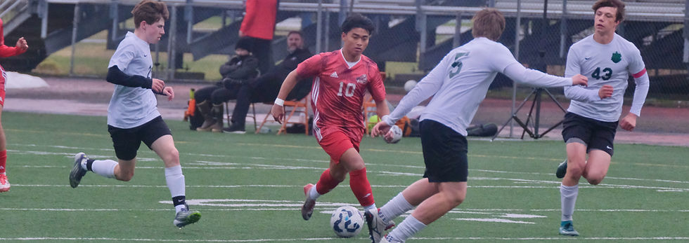 JDHS junior Sam Mazon (10) splits Colony defenders at Adair-Kennedy Memorial Park on Friday, May 8, 2026. Mazon earned Railbelt Conference first-team honors this week. (Klas Stolpe / Juneau Independent).