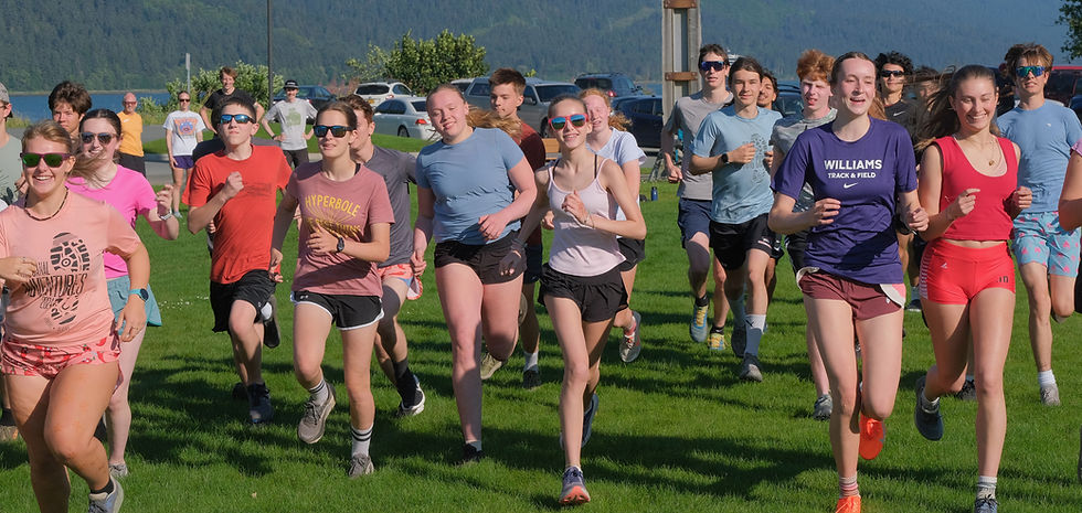 Members of the Juneau-Douglas High School: Yadaa.at Kalé cross country running team warm up during practice at Savikko Park on Monday, Aug. 10, 2026. (Klas Stolpe / Juneau Independent)