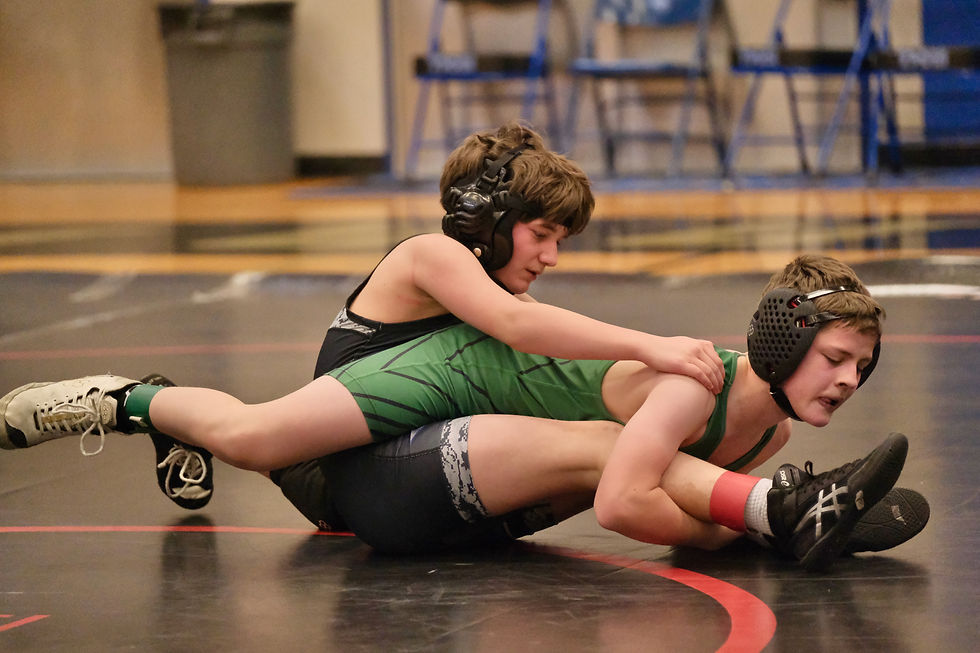 Thunder Mountain's Finn Troutman and Haines Middle School's Leon Rogers grapple in their 105-pound match during the Harben Invitational at TMMS on Saturday, Feb. 14, 2026. (Klas Stolpe / Juneau Independent)