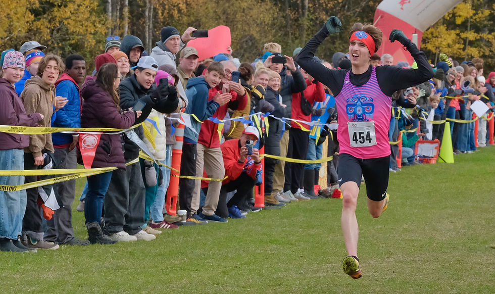 East Anchorage senior Katahdin Staples celebrates as he wins his third straight Division I boys Alaska State XC Championship at Anchorage's Bartlett High School trails on Saturday, Oct. 3, 2026. Staples ran 15:34. (Klas Stolpe / Juneau Independent)