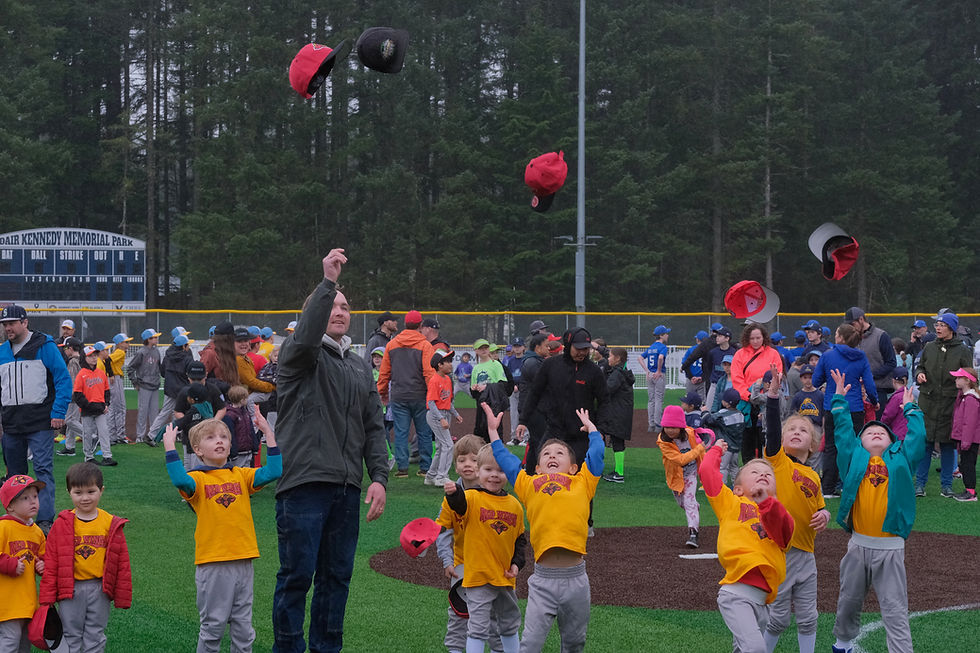 Members of team Red Wings throw their hats to celebrate during the Gastineau Channel Little League's Opening Day Ceremonies at Adair-Kennedy Memorial Park on Saturday, May 2, 2026. (Klas Stolpe / Juneau Independent)
