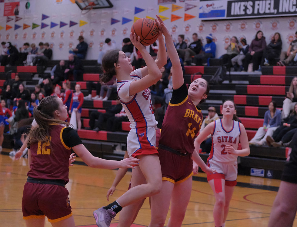 Sitka freshman Addie Marx (13) has a shot contested by Mt. Edgecumbe freshman Evangeline Hank (14) during the 3A girls championship game at the 2026 Alaska Airlines Region V 2A/3A/4A Basketball Tournament on Saturday, March 7, 2026, in the Juneau-Douglas High School: Yadaa.at Kalé George Houston Gymnasium. (Klas Stolpe / Juneau Independent)