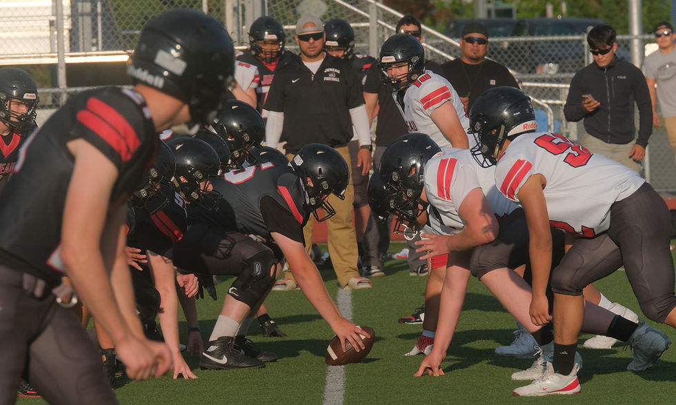 The Juneau-Douglas High School: Yadaa.at Kalé Crimson Bears football team scrimmage at Thunder Mountain Middle School's Falcons' Field on Monday, Aug. 10, 2026. (Klas Stolpe / Juneau Independent)