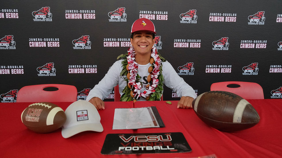 Juneau-Douglas High School: Yadaa.at Kalé Crimson Bears senior Noah Ault signed a letter of intent Tuesday, May 26, 2026, in the JDHS commons to attend Valley City State University in Valley City, North Dakota, and play football for the Vikings. (Klas Stolpe / Juneau Independent)
