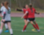 Juneau-Douglas High School: Yadaa.at Kalé sophomore Zoe Tagsip (3) celebrates her goal with senior Peyton Wheeler (5), who assisted, during the Crimson Bears' 1-0 win over the Colony Knights at the Adair-Kennedy Memorial Park pitch, Saturday, May 9, 2026.  (Klas Stolpe / Juneau Independent)