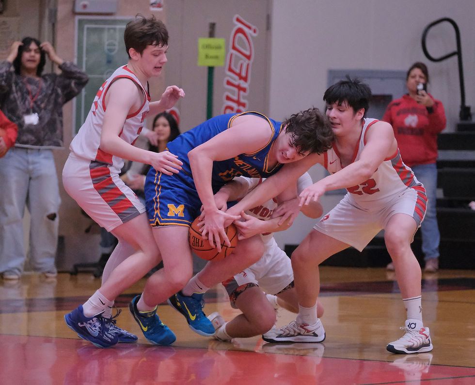 Metlakatla junior Rocco Lindsey is fouled as he secures a rebound from Wrangell's Aadyn Gillen, sophomore Michael Cook and senior William Massin during the Chiefs 42-39 elimination game win over the Wolves at the 2026 Alaska Airlines Region V 2A/3A/4A Basketball Tournament on Friday, March 6, at the Juneau-Douglas High School: Yadaa.at Kalé George Houston Gymnasium. (Klas Stolpe / Juneau Independent)