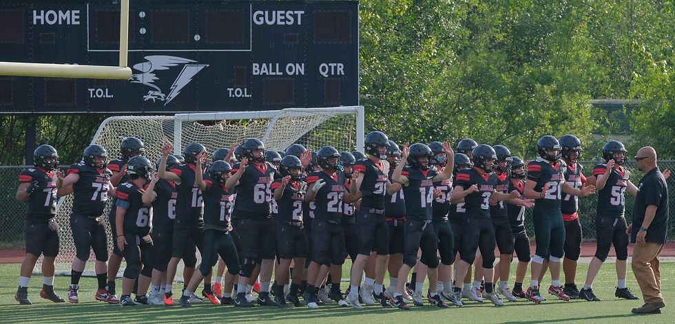The Juneau-Douglas High School: Yadaa.at Kalé Crimson Bears football team warms up at Thunder Mountain Middle School's Falcons' Field on Monday, Aug. 10, 2026. (Klas Stolpe / Juneau Independent)