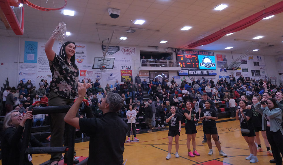 Craig coach Vanessa James holds the championship net after the Lady Panthers defeated the Metlakatla Miss Chiefs 47-41 in the 2026 Alaska Airlines Region V 2A/3A/4A Basketball Tournament on Friday, March 6, at the Juneau-Douglas High School: Yadaa.at Kalé George Houston Gymnasium. (Klas Stolpe / Juneau Independent)